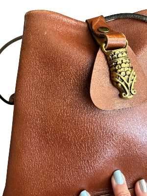 Vintage 1970s Artisan-Made Leather Bucket Bag with Dragon Medallion